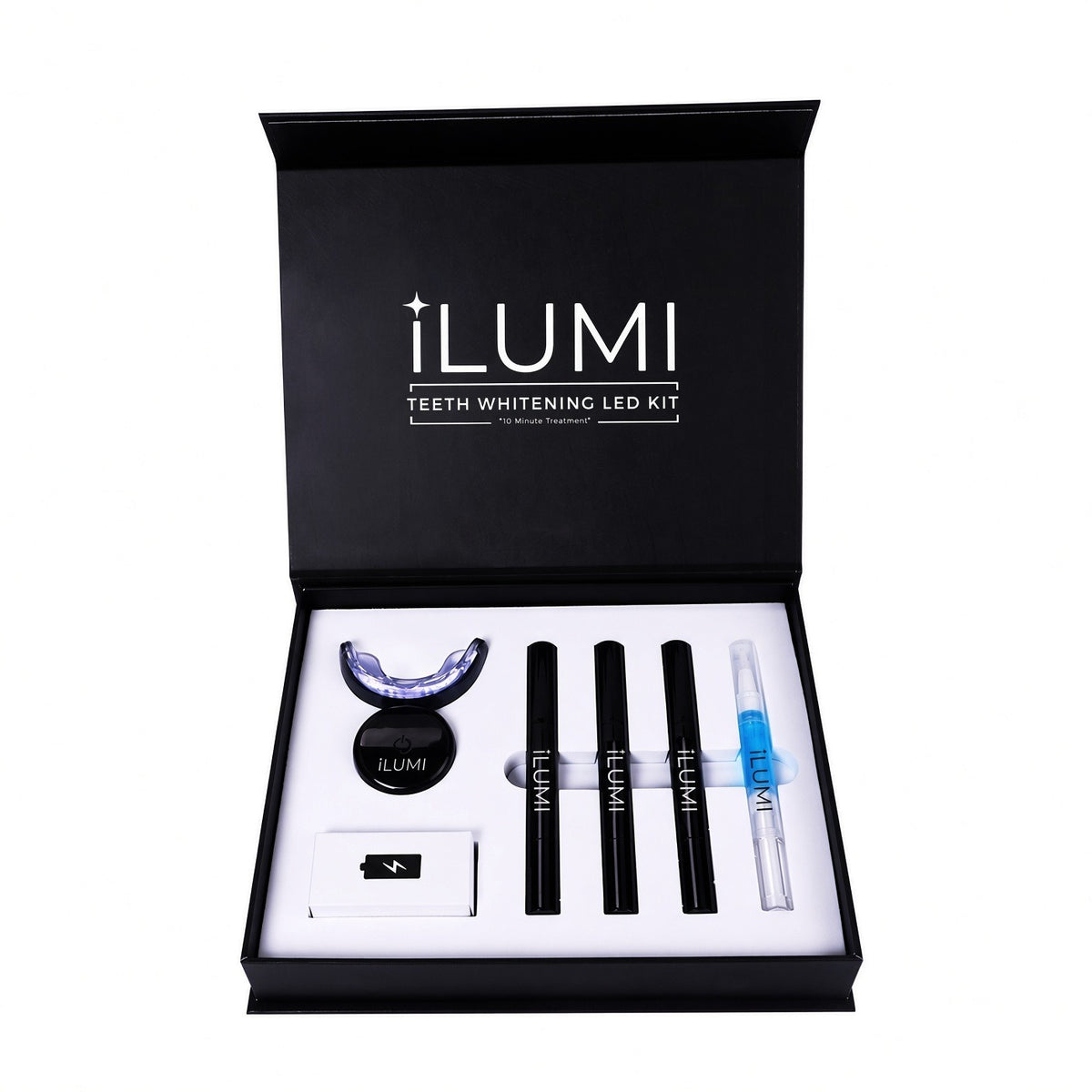 ILUMI LED Teeth Whitening Kit, open: LED device, whitening gel pens, desensitizing gel pen, charging cable and shade guide